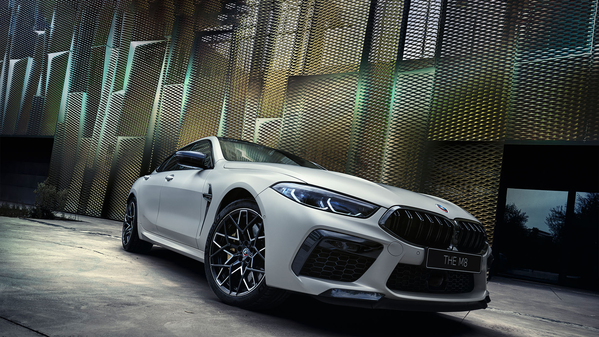 BMW M8 Competition Coupé. The first-ever BMW M8 Competition Coupé in Marina Bay Blue metallic, three-quarter front view.